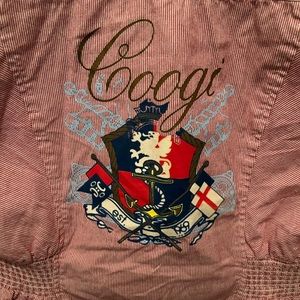 Snap front - could be worn like a jacket.  Great detailing.  Very well made.